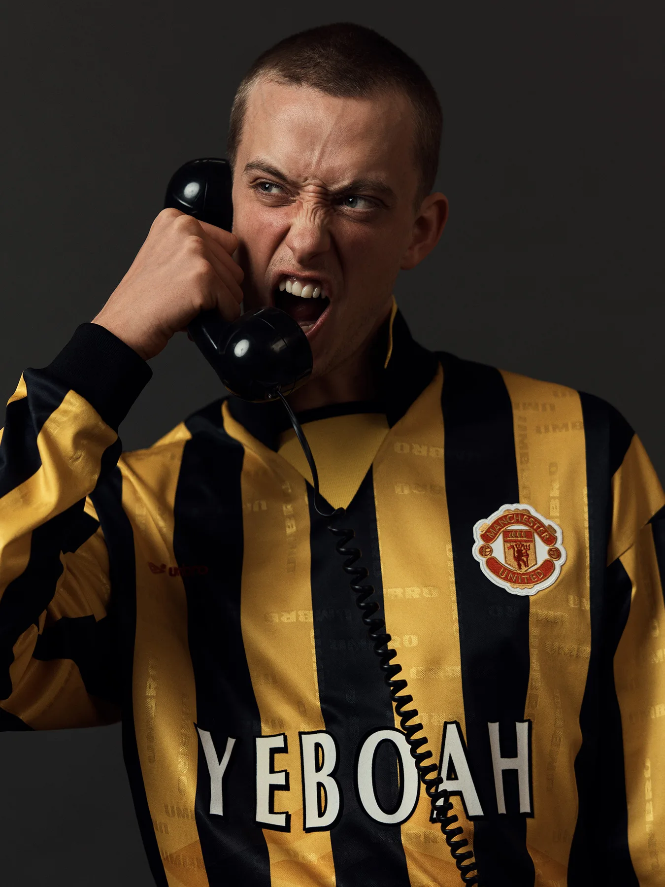 Neil Bedford photographs a male model in football shirts made in error. Designed to create debate online.